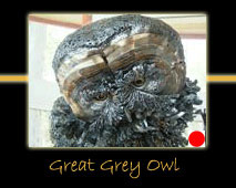 great grey owl steel sculpture by canadian sculptor hilary clark cole